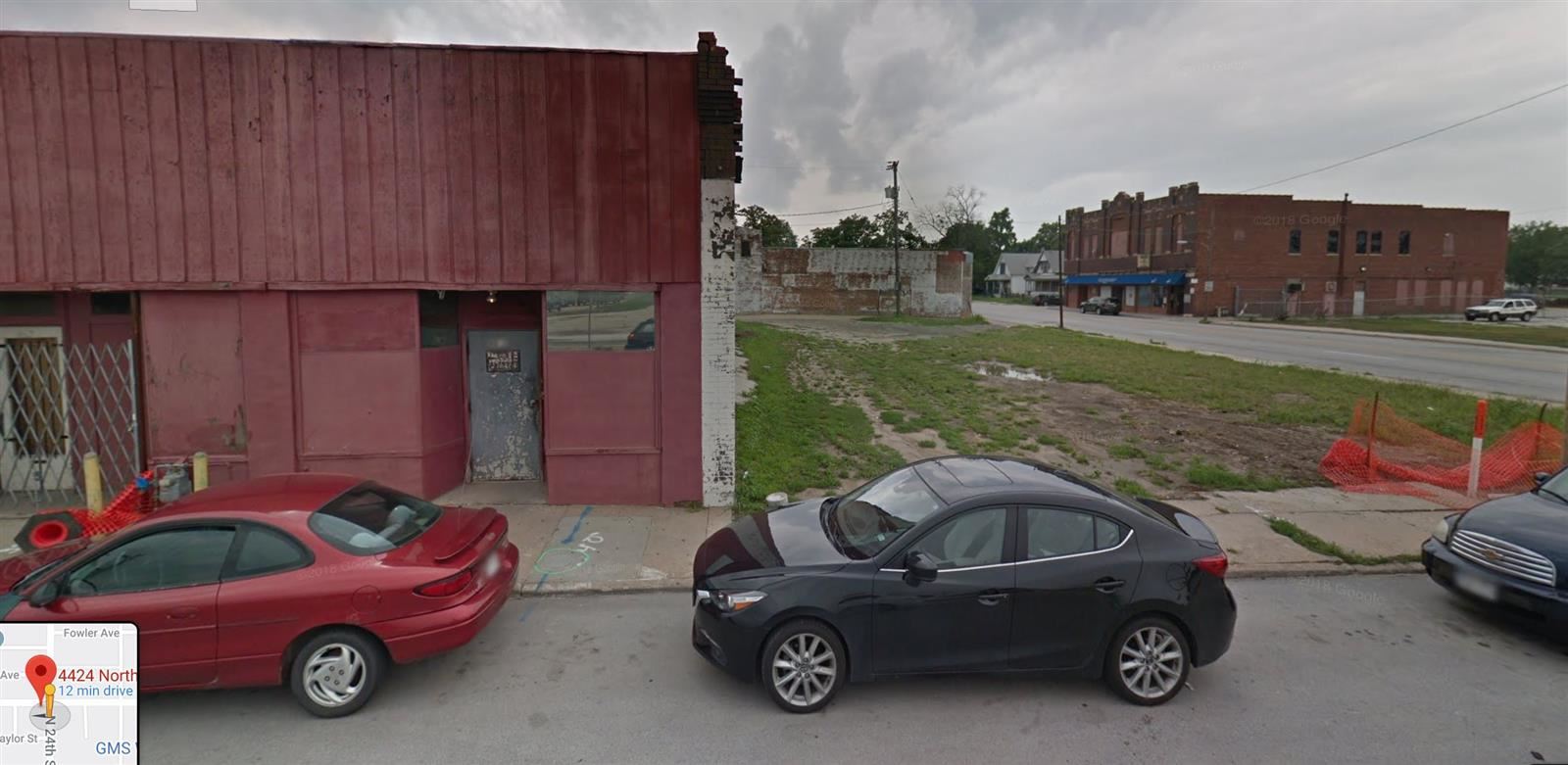 Modern image of a building with an empty lot next to it